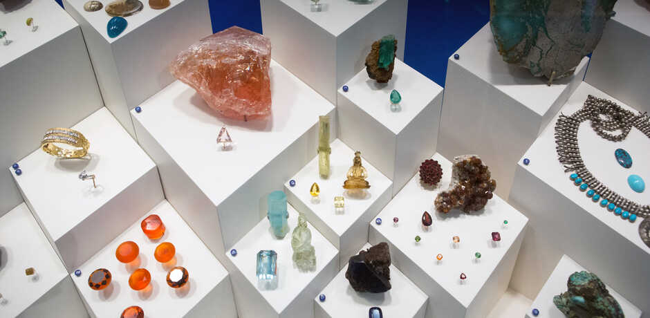 Colorful cut and raw gems and minerals on exhibit at the Academy
