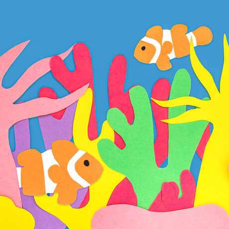 Construction paper coral reef scene with clownfish