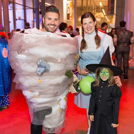 Family dressed up as Wizard of Oz characters at SuperNatural event at the Academy