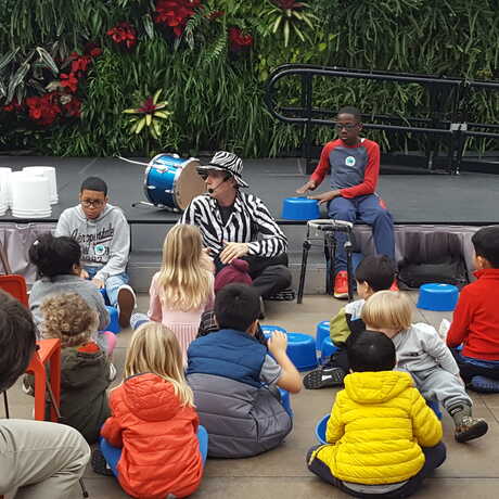 Drumming Magic leads a drum performance with youngsters