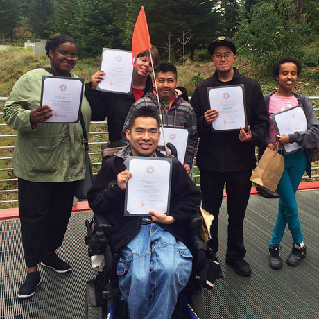 Proud graduates of the immersive internship program for young adults with disabilities pose with their certificates