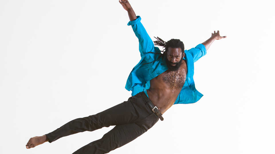 woman and man in blue and black and dancing