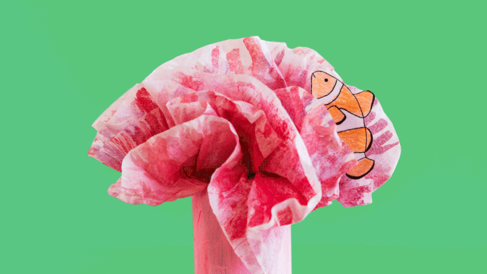 Animated GIF of paper clownfish swimming through paper anemone